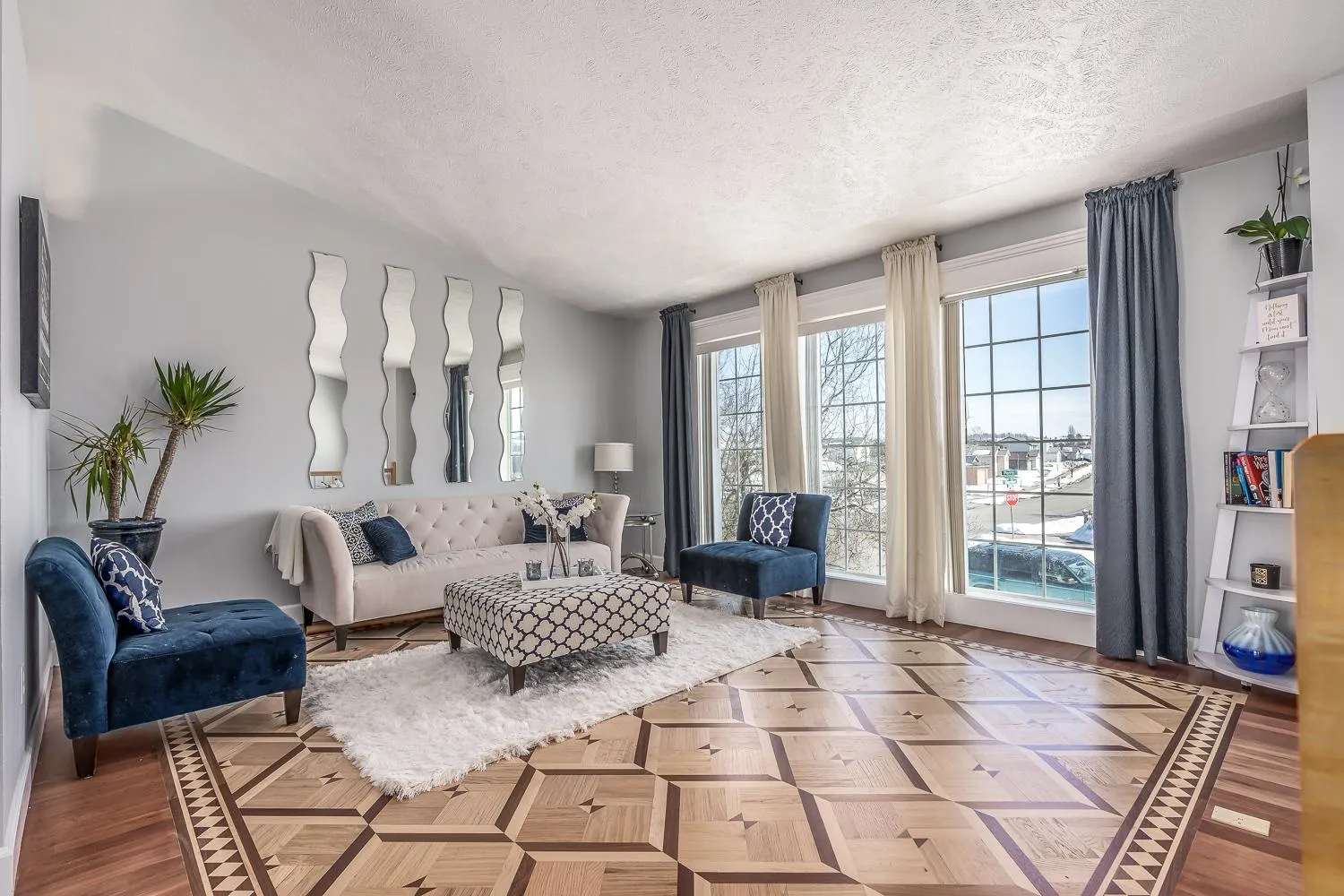Custom wood parquetry floor with a geometric marquetry border that won an NWFA Wood Floor of the Year award