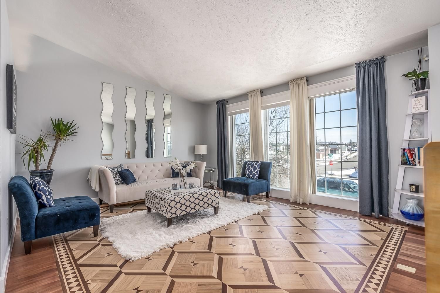 Whole-room parquetry field with a patterned perimeter border — oak and maple, custom commission