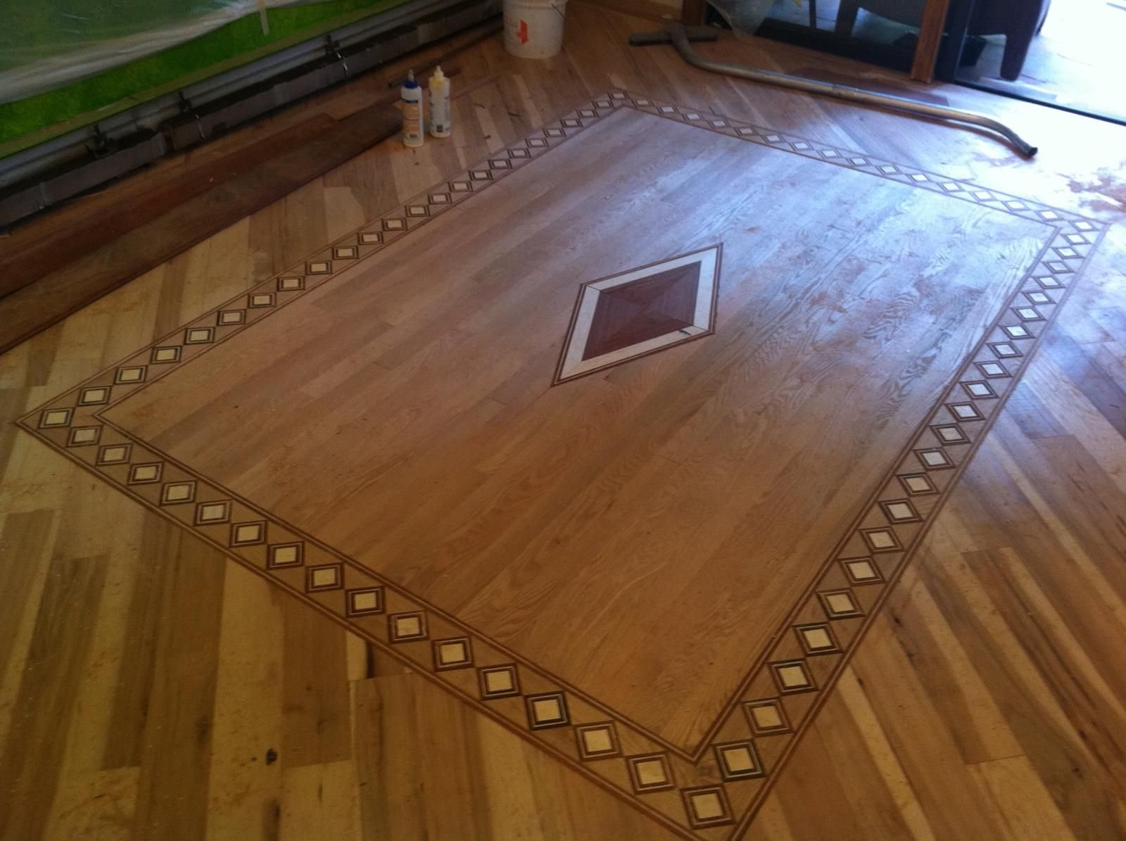 Double diamond border framing an oak field, with a diamond inlay at center — oak, custom commission