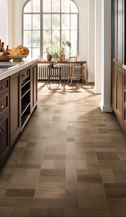 Chevron-pattern parquet floor in a warm, classic kitchen