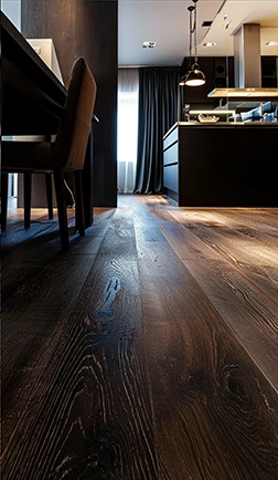 Glossy dark hardwood floor in a contemporary kitchen and living area