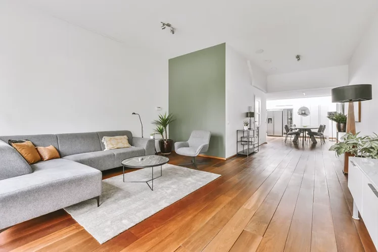 Stylish living room with comfortable furniture over a restored hardwood floor