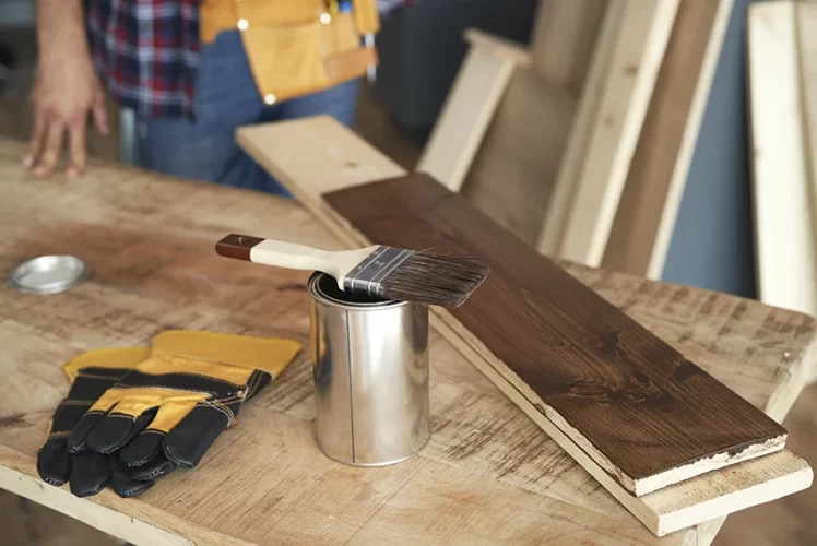Worktable set up with a paint can and wooden boards