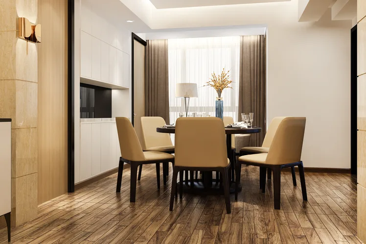 Modern dining and living room with warm wood-look flooring