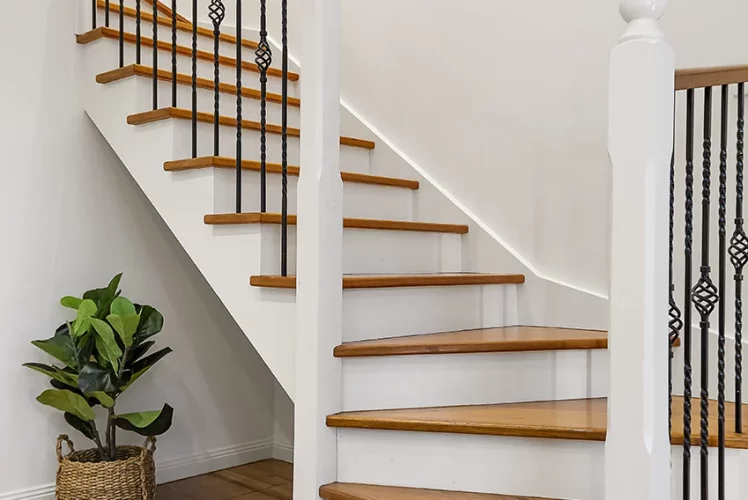 Wooden staircase with evenly spaced steps in a bright interior