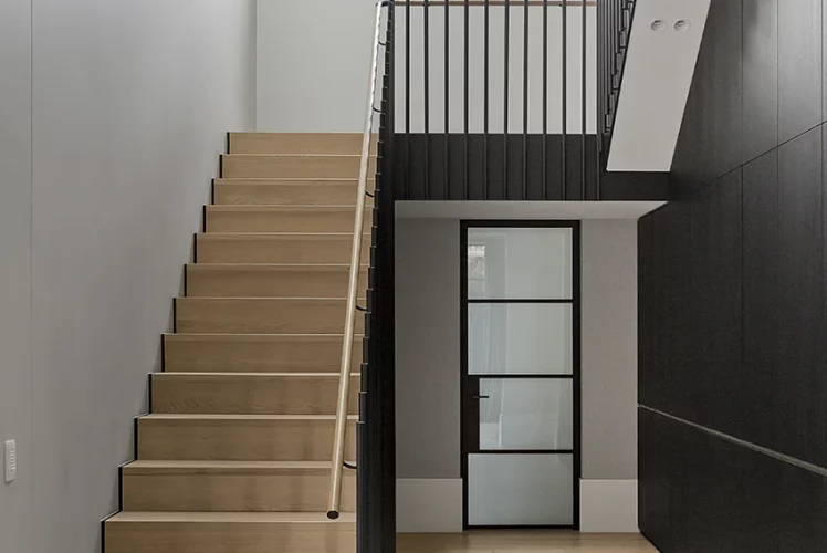 Wooden staircase with a clean, open railing design